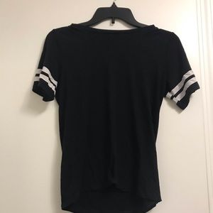 Black shirt with white rings on sleeves